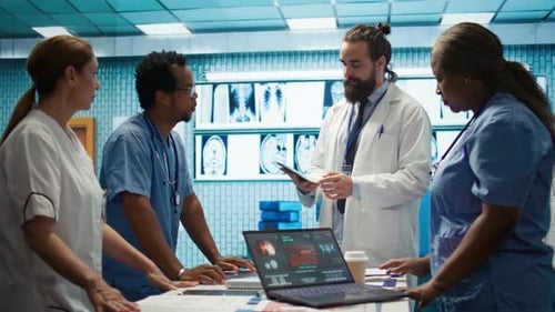 Medical Team Studying Scans in Hospital Room