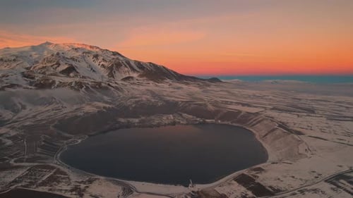 Misty Dawn in the Winter on the Lake
