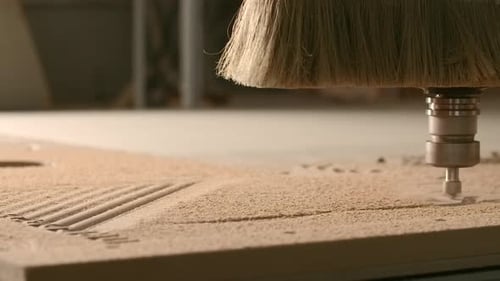 Close up of wood carving machine making pattern on a wooden plank