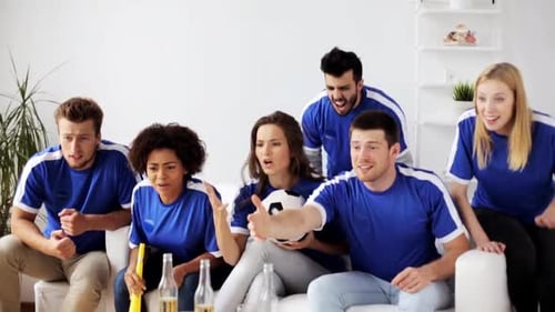 Friends Watching Soccer Game Celebrating Goal Together Indoors