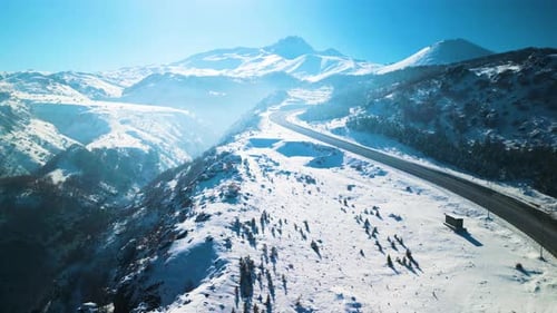 Snowy Mountain Road on a Bright Winter Day