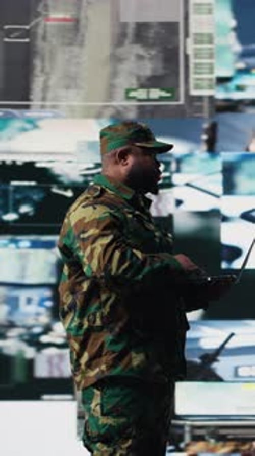 Soldier in Camo Uniform Using Laptop