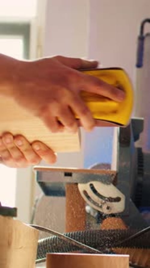 Close Up Sanding Light Wood Block Indoors