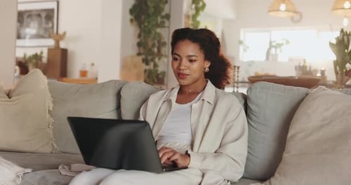 Woman Working on Laptop, Relaxing at Home