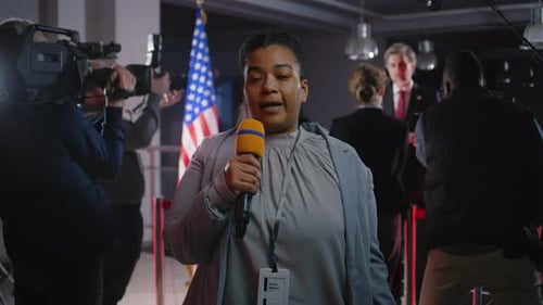 Female Journalist Reporting at a Press Conference