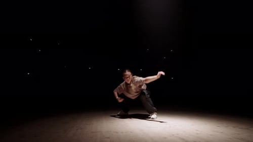 Young Woman Dancing Contemporary Style in Spotlight