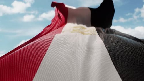 Realistic Egyptian Flag Waving in Slow Motion Against a Blue Sky