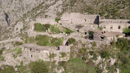 Aerial view of medieval fortress ruins overlooking Kotor Bay, Montenegro.