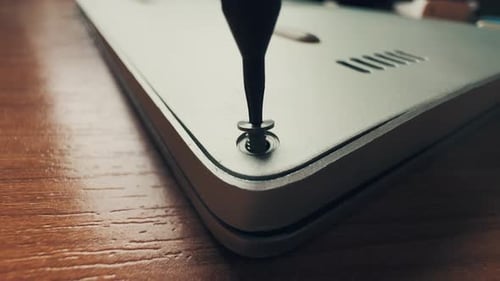 Screwdriver Attaching Computer Back Panel Close Up