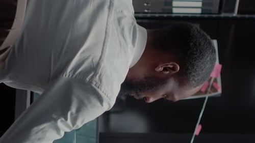 Man Works on Computer at His Desk