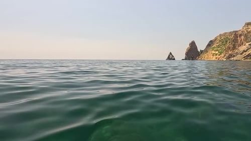 Sea Water Surface Background Low Angle View From Kayak Camera Flies Over the Clear Green Sea Water