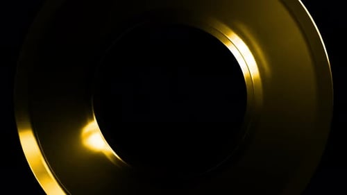 Golden rings rotating on black background
