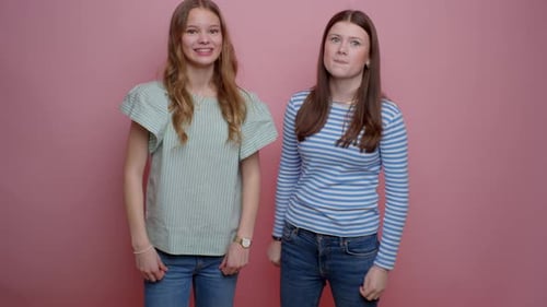 Best Friends Being Quirky In A Pink Setting