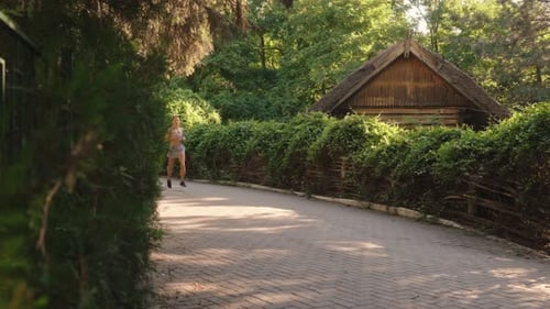Woman Jogging In The Park