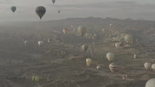 Aerial video of hot air balloons at sunrise, iconic destination behind Cappadocia Turkey
