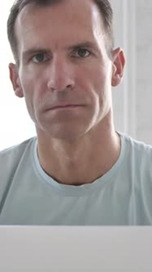 Man Looking at the Camera Indoors Portrait