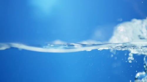 Smooth flowing water ripples in slow motion, highlighting the clarity and calmness of underwater wav