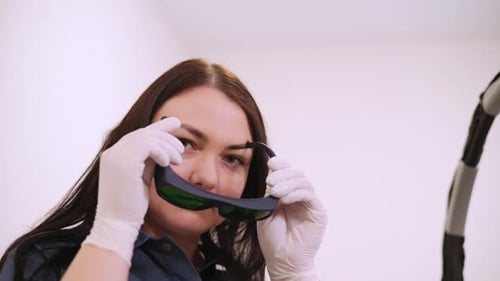 Medical Professional Puts on Protective Eyewear