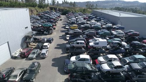 Aerial view of a junkyard and large group of wrecked cars
