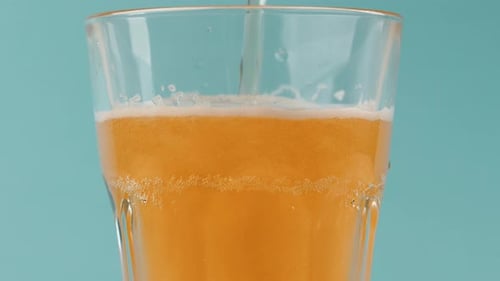 Beer Being Poured into a Glass Close Up