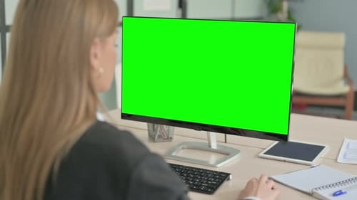 Young Businesswoman Using Desktop with Green Screen