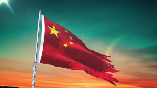 China Flag Waving Against Beautiful Sunset Sky Background