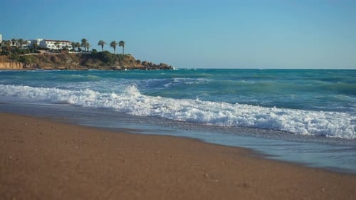 Wide Shot Azure Blue Mediterranean Sea Waves Rolling on Golden Sand on Cyprus Tourist Resort Ocean