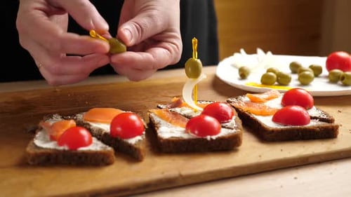 Preparing Elegant Salmon Appetizer Sandwiches Close Up