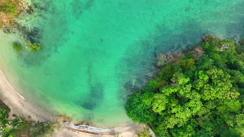 Tropical coastline with beautiful curved beaches, aerial view from drone.