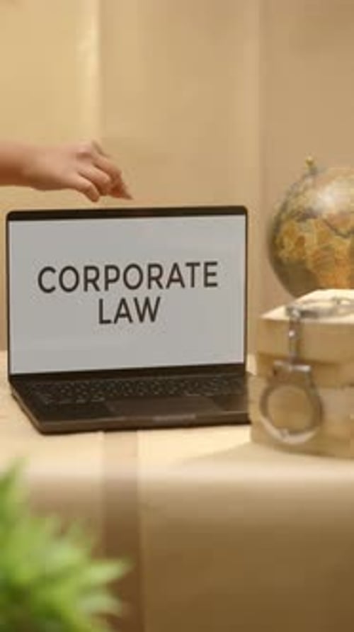 VERTICAL VIDEO OF CORPORATE LAW DISPLAYED IN LEGAL LAPTOP SCREEN
