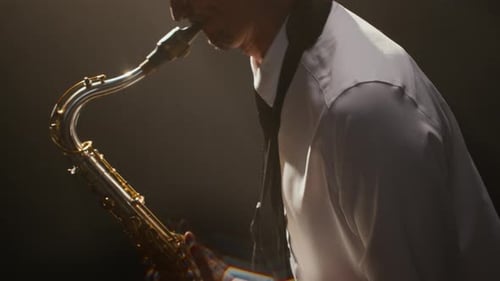 Skilled Male Saxophonist Performing Intricate Solo