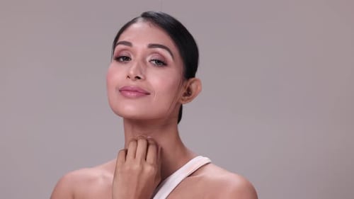 Attractive Young Woman Posing in Studio Close Up