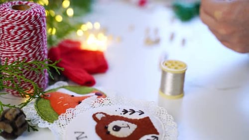 Close Up Hands of Craft Woman Create DIY Soft Toys Decorations for Christmas Interior