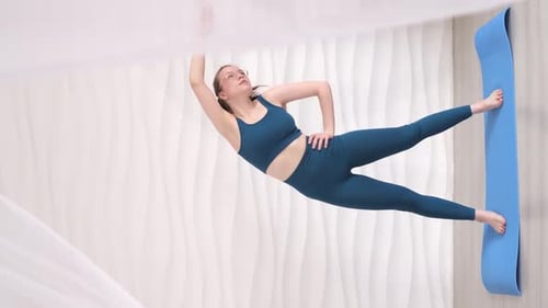 Midaction a Woman Performs an Advanced Yoga Pose Her Body Perfectly Balanced Demonstrating the Power
