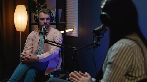 Podcast Host Asking a Thoughtful Question to the Guest