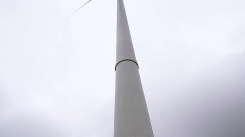 wind turbines generate energy on a cold windy day
