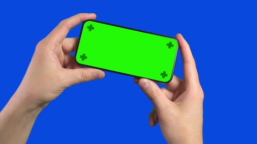 Hands Holding Chroma Key Smartphone on Blue Screen