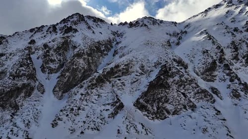 Snowy Mountain Peaks Aerial in Winter