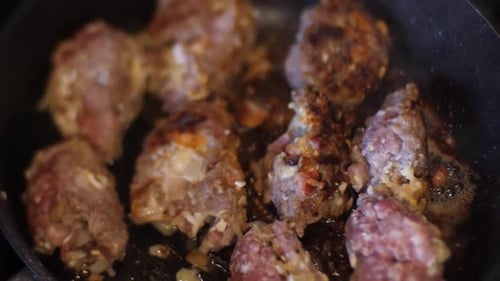 Meatballs fried in a pan. Cooking meat at home