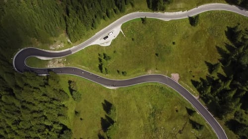 Bird eye view and reveal drone shot of The Great Dolomites road in Italy