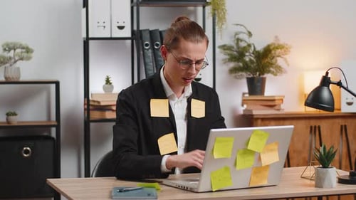 Tired Exhausted Businessman with Laptop Sticky Notes with Many Tasks Sitting at Home Office Desk