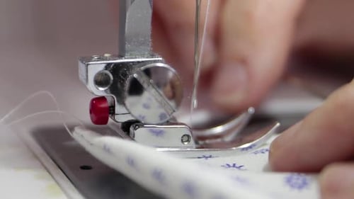 Seamstress Sewing A Fabric Face Masks To Prevent The Coronavirus.- close up shot
