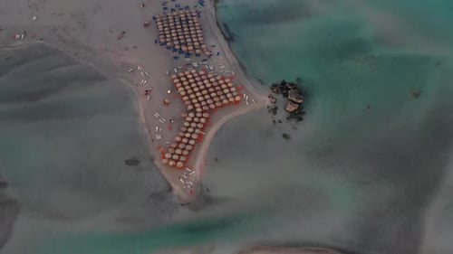 Aerial drone panoramic view video of famous exotic paradise sandy emerald beach of Elafonissi in Sou