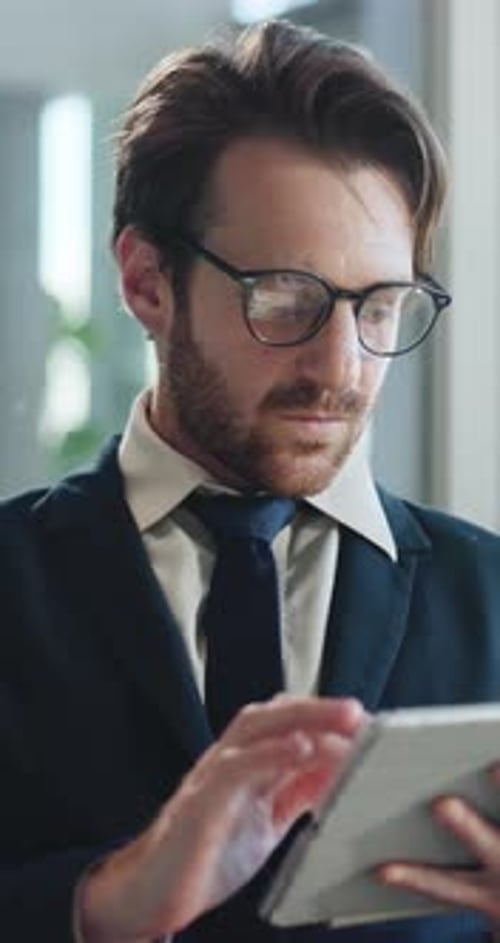 Corporate, online and business man on tablet in office for finance report, proposal and research
