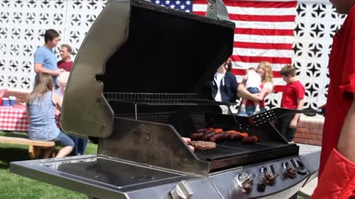 Man Cooking on Barbecue Grill 4th