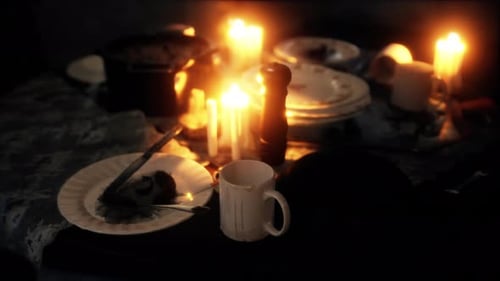 Warm Candlelight Flickering on an Intimate Table Setting