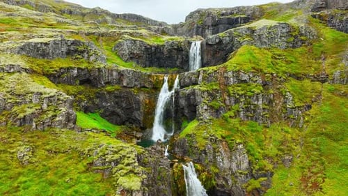 Wispy Waterfalls Flowing Over Cliff Mountain River Falling Over Cliff Creating Many Waterfalls with