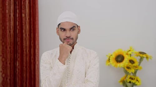 Pensive Young Man in Cap Contemplating