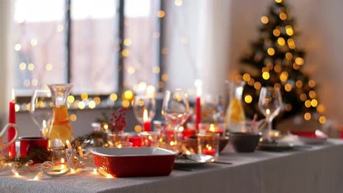Festive Table Setting with Christmas Tree and Lights