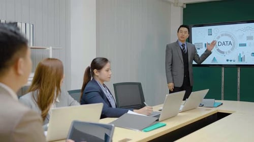 Professional Team Presentation of Data in Modern Office